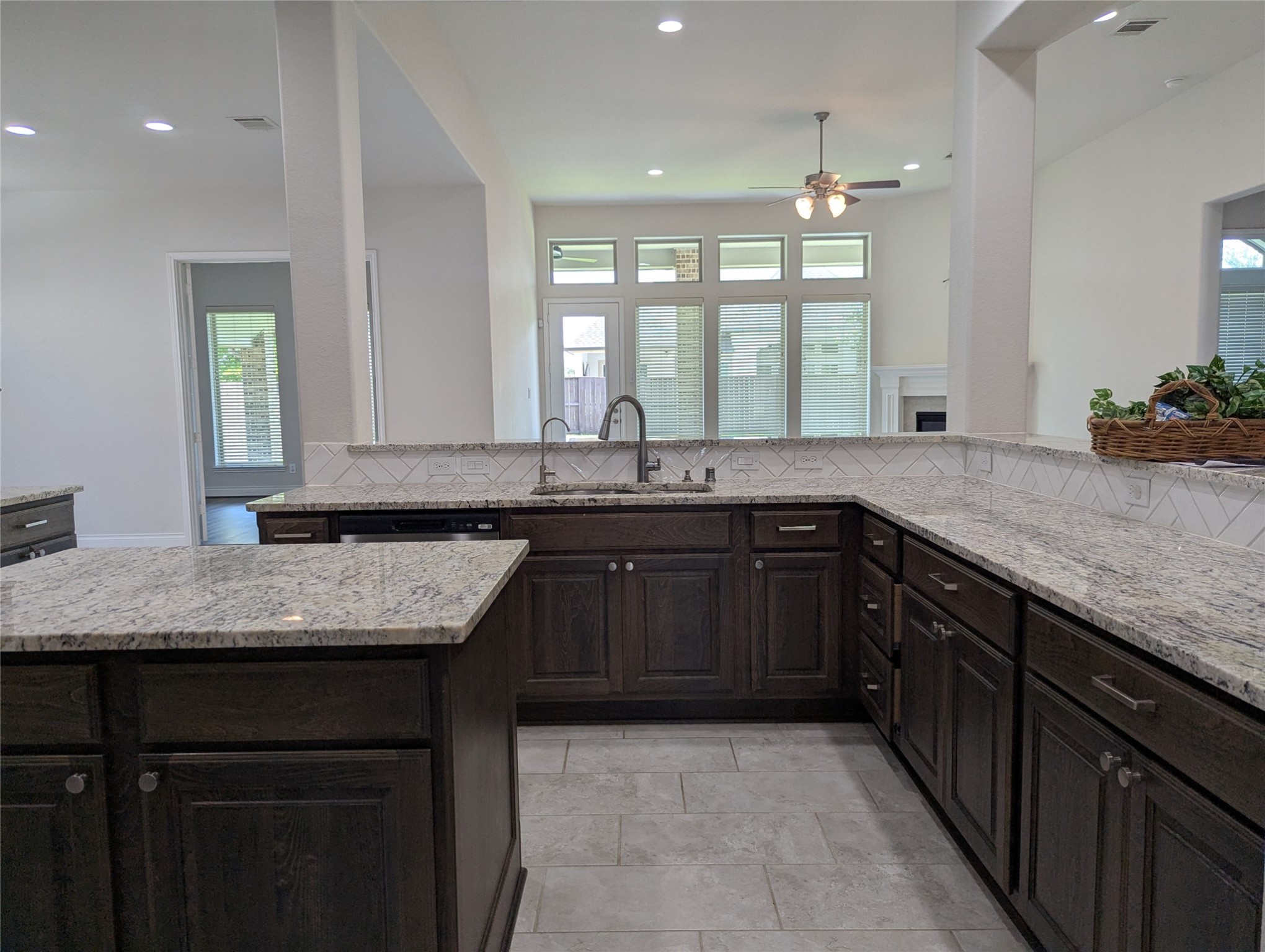 10323 Granite Court Rosharon, TX 77583 - Photo 27 of 44 a kitchen with granite countertop kitchen island a sink appliances and a counter space