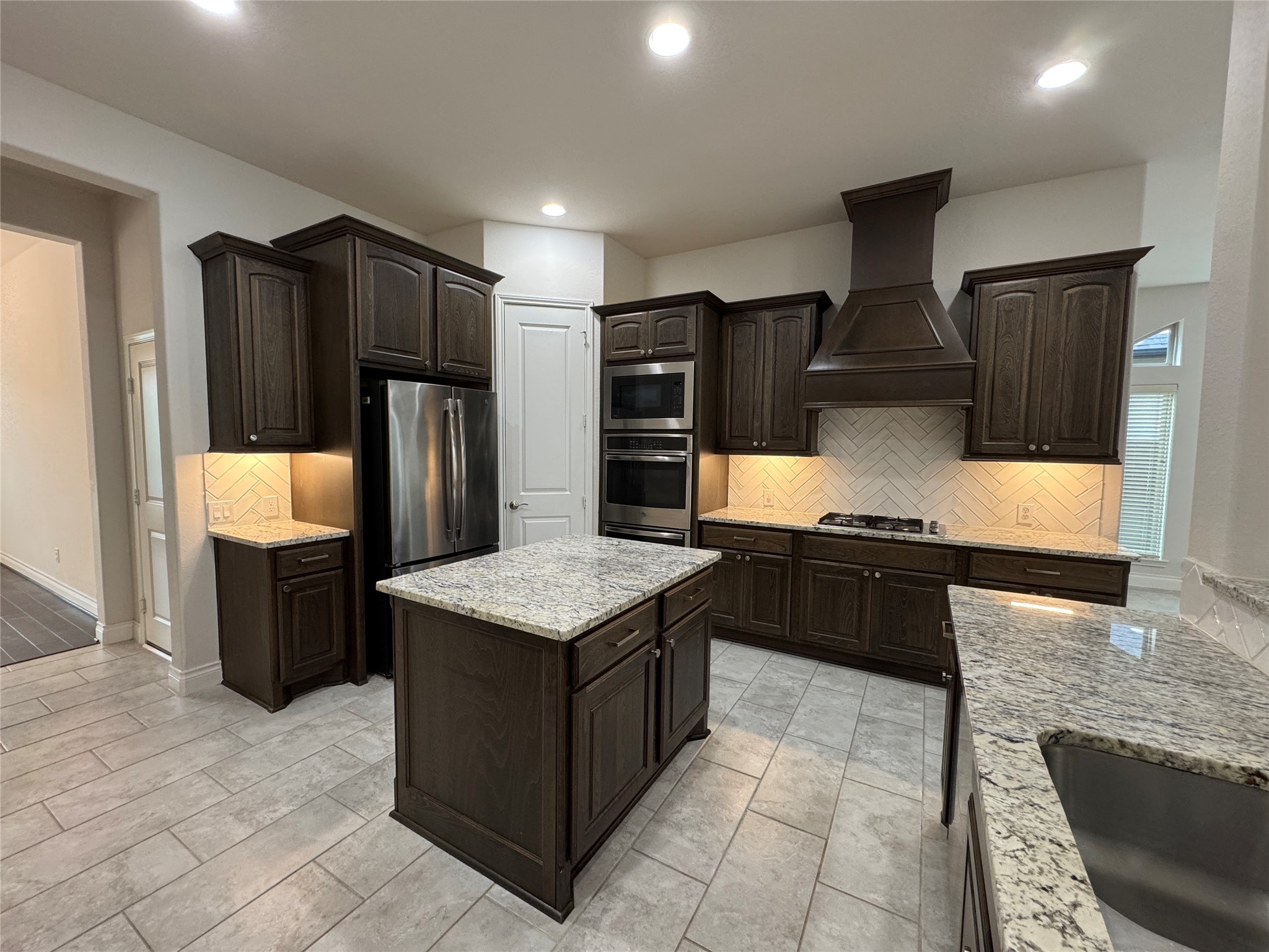 10323 Granite Court Rosharon, TX 77583 - Photo 28 of 44 a kitchen with stainless steel appliances granite countertop a refrigerator a stove and a sink