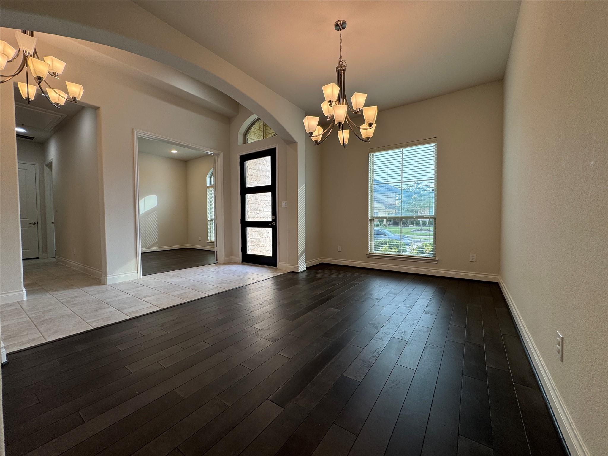 10323 Granite Court Rosharon, TX 77583 - Photo 29 of 44 an empty room with wooden floor and windows