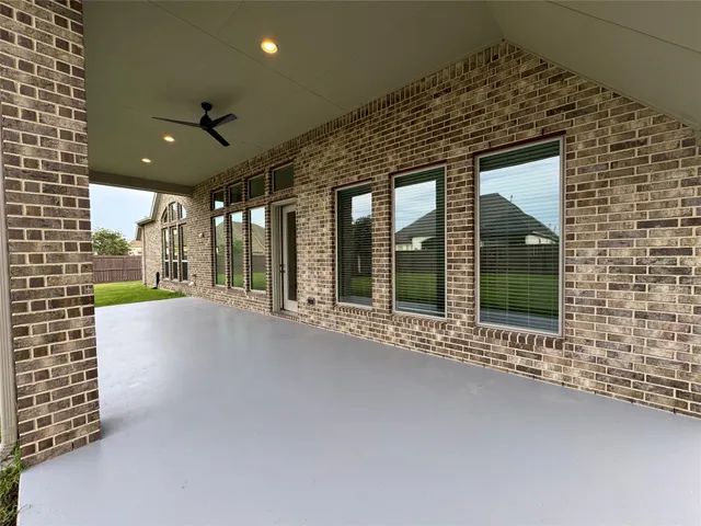 a view of a lake with boats and trees in the background