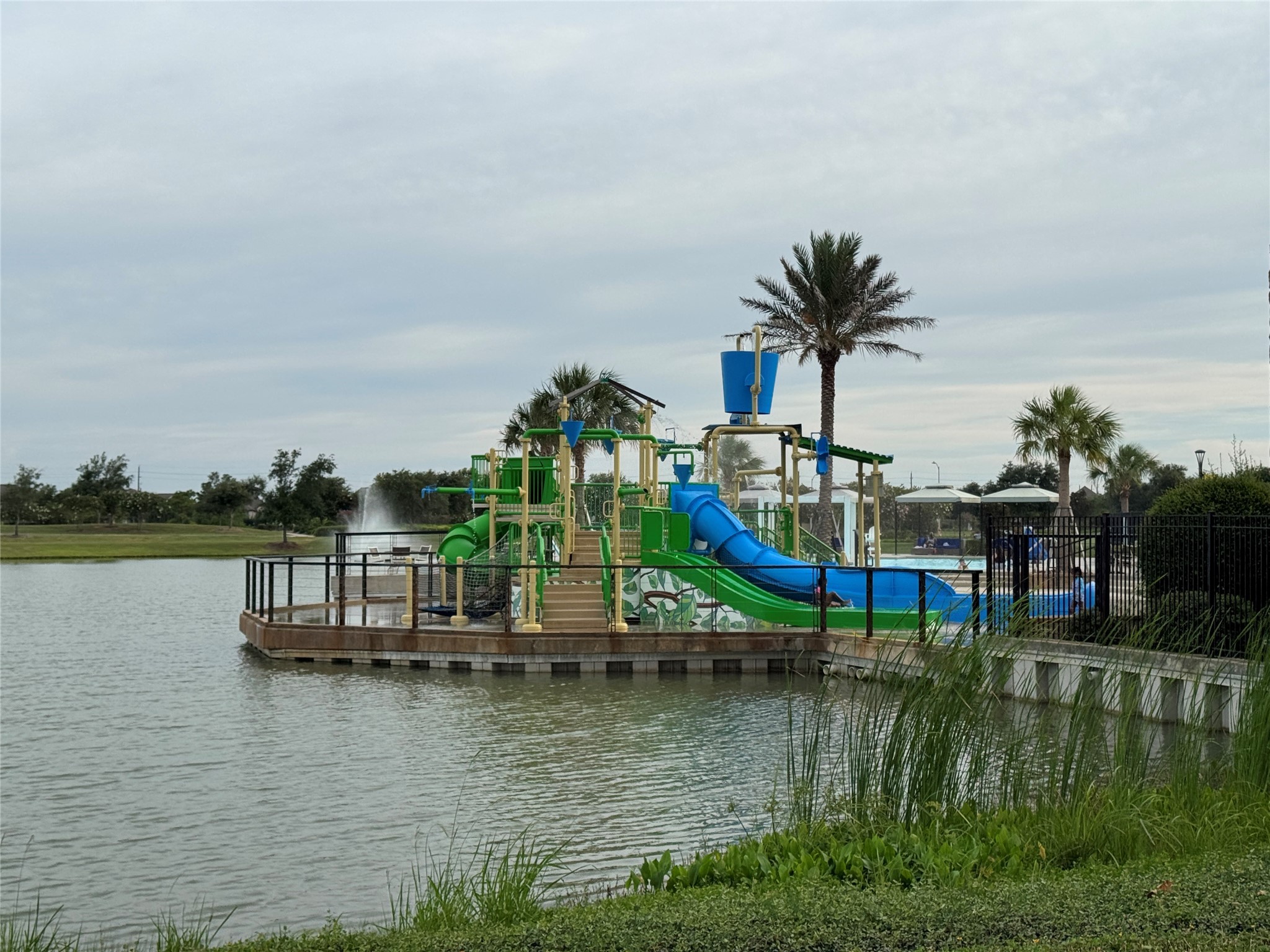 10323 Granite Court Rosharon, TX 77583 - Photo 43 of 44 a view of a lake with boats and trees in the background