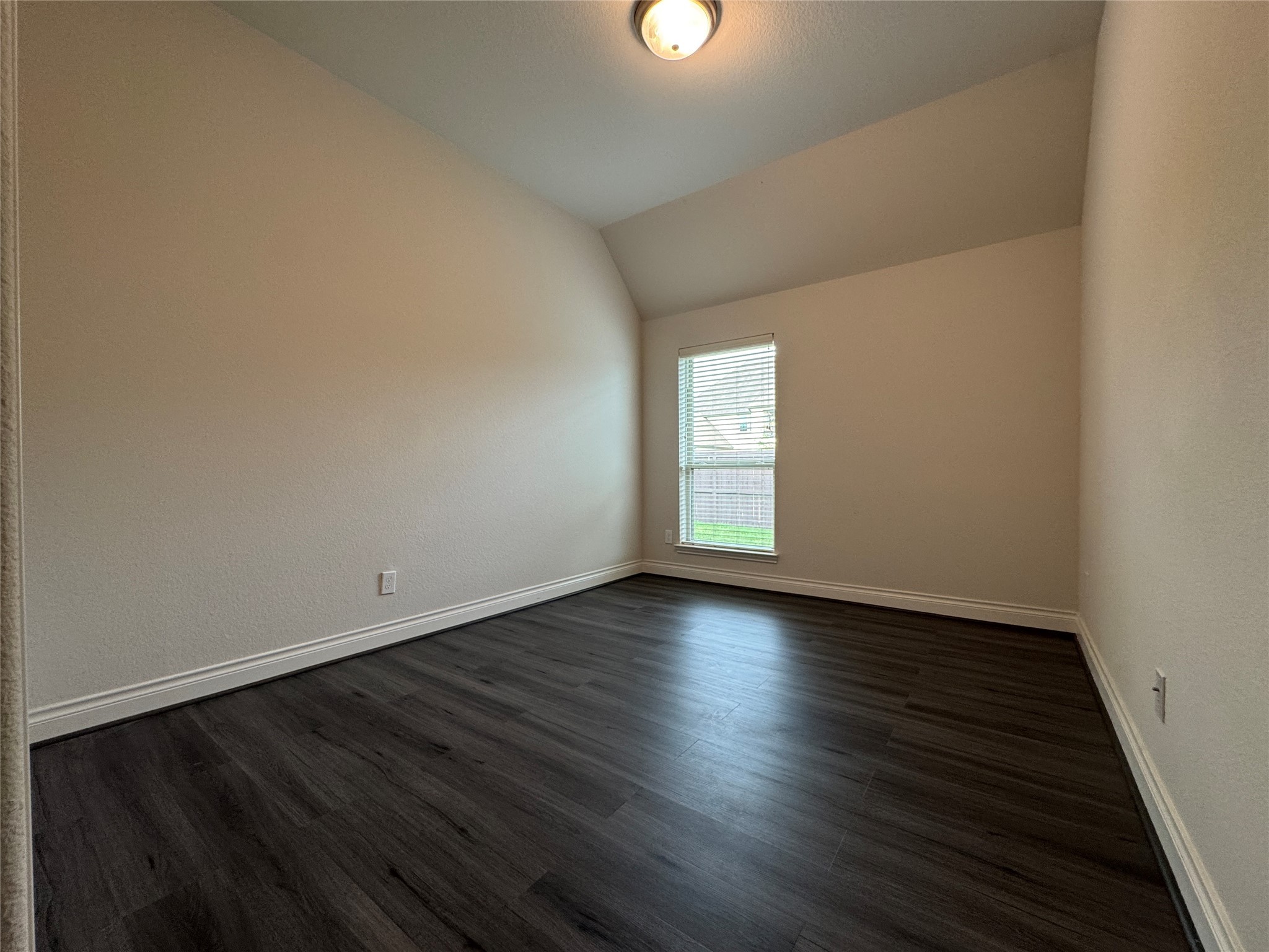 10323 Granite Court Rosharon, TX 77583 - Photo 5 of 44 a view of an empty room with wooden floor and a window
