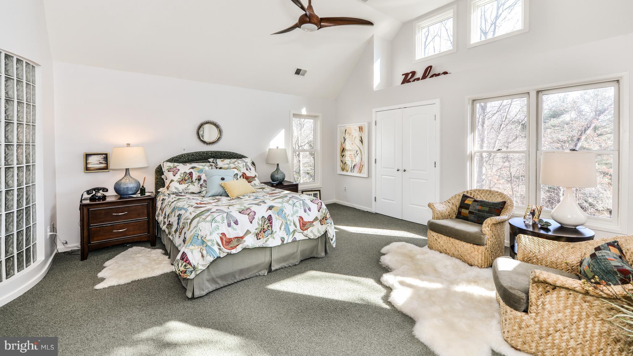 2041 Beacon Place Reston, VA 20191 - Photo 13 of 30 a bedroom with a bed and a couch