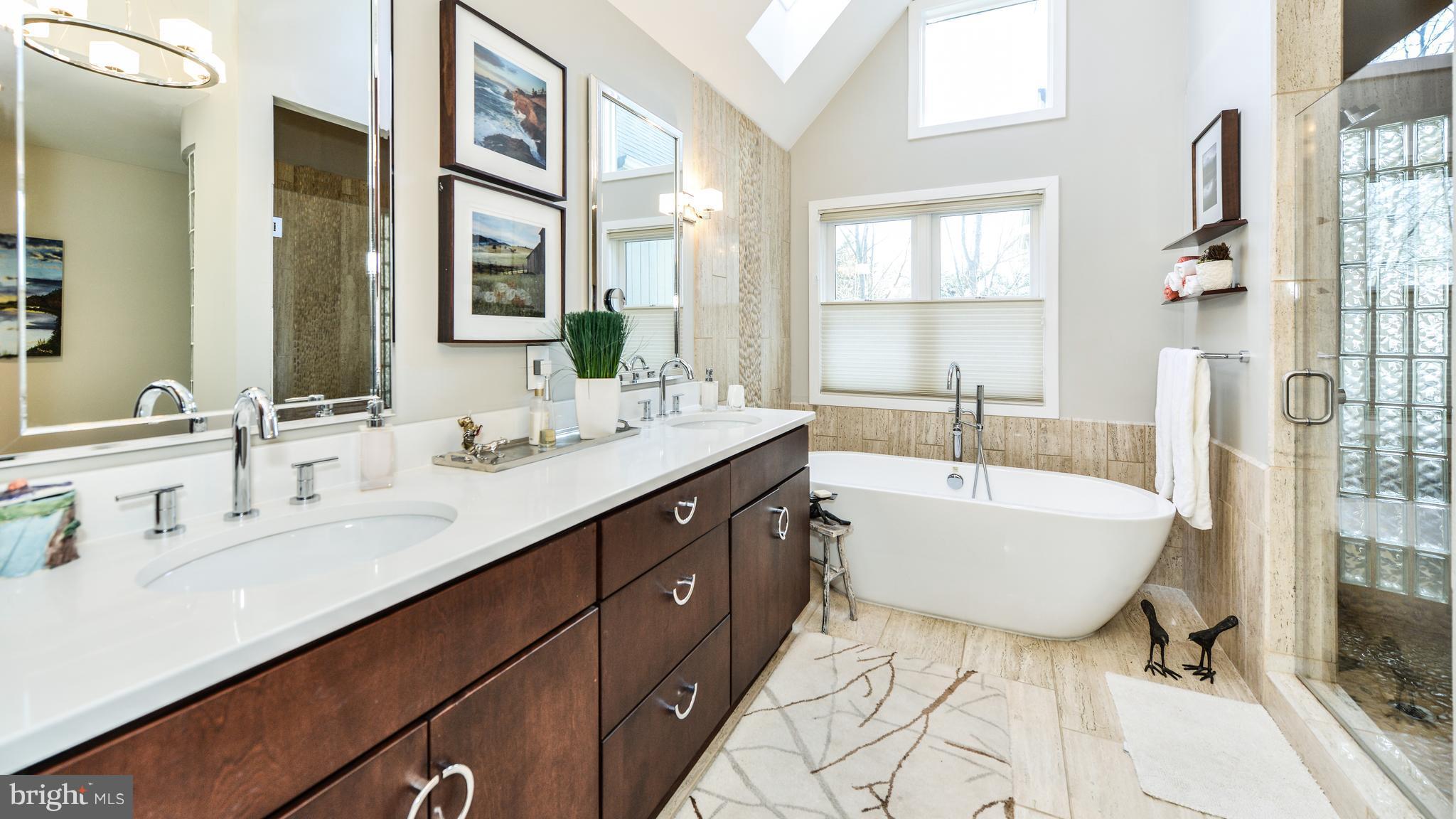 2041 Beacon Place Reston, VA 20191 - Photo 15 of 30 a bathroom with a tub sink double vanity mirror and a bathtub