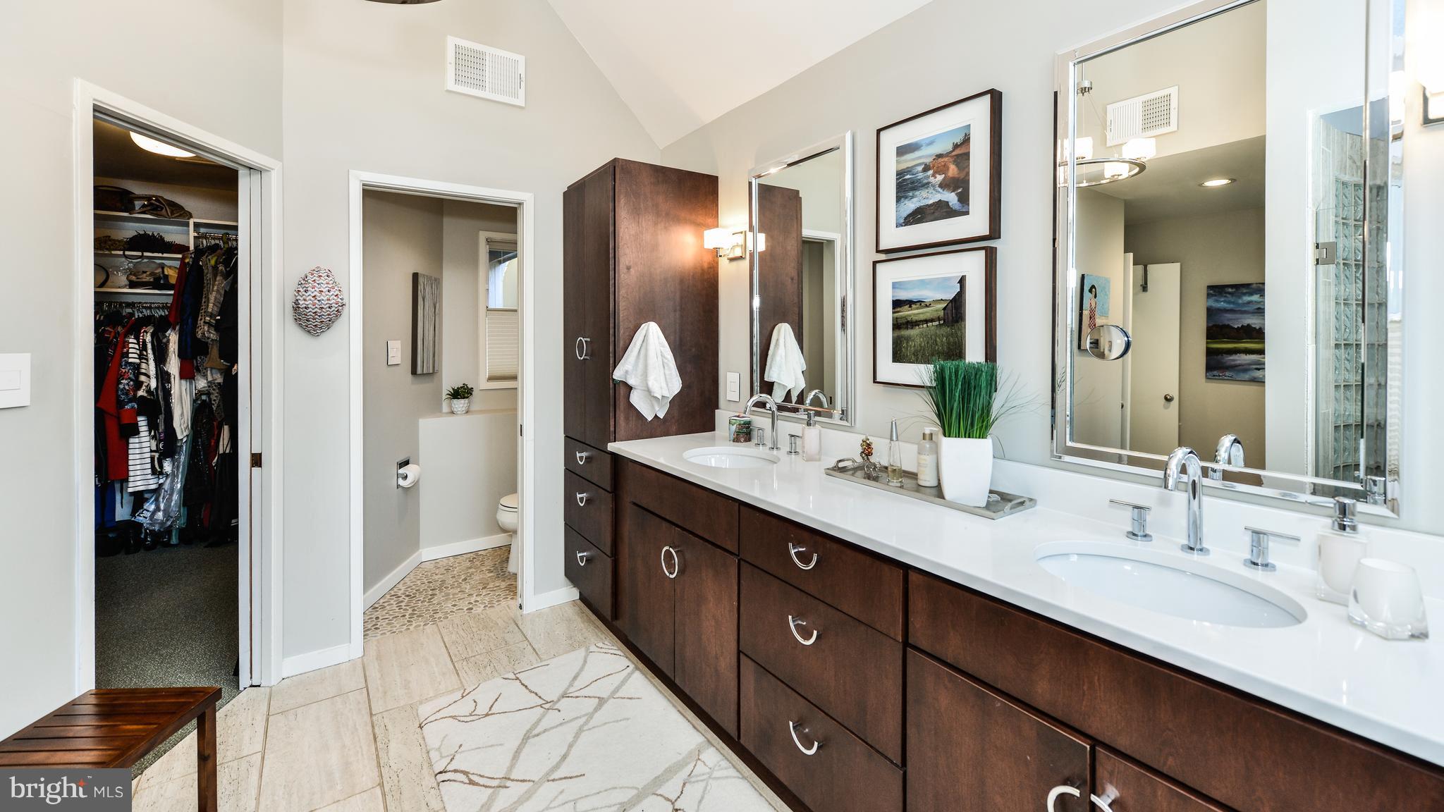 2041 Beacon Place Reston, VA 20191 - Photo 16 of 30 a spacious bathroom with double vanity and a mirror