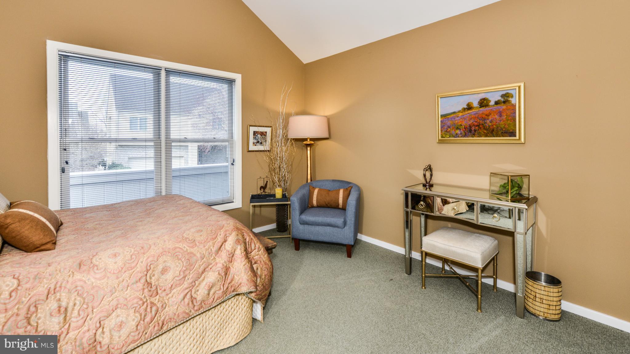 2041 Beacon Place Reston, VA 20191 - Photo 19 of 30 a bedroom with a bed and a window