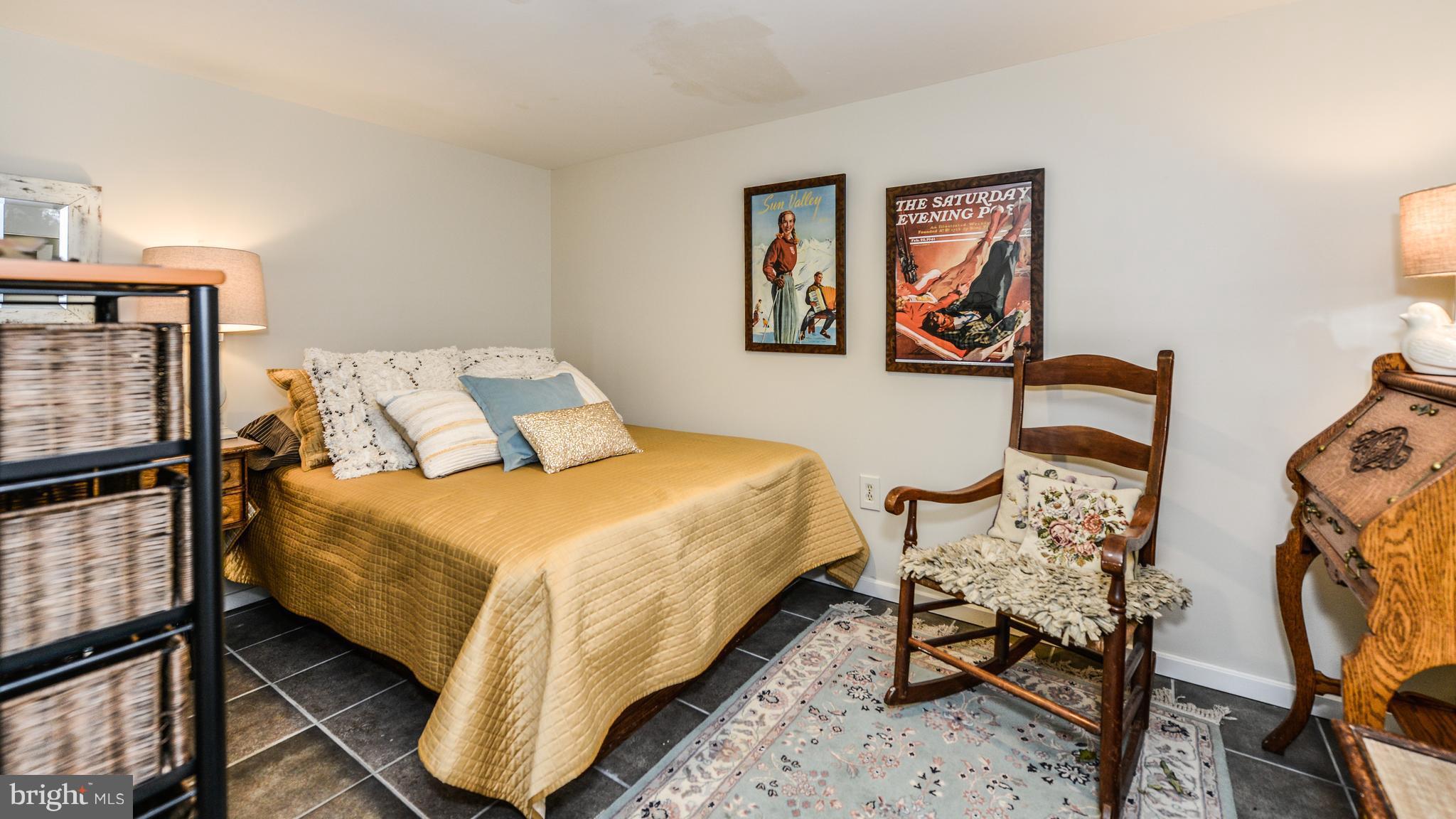 2041 Beacon Place Reston, VA 20191 - Photo 20 of 30 a bed sitting in a bedroom next to a window