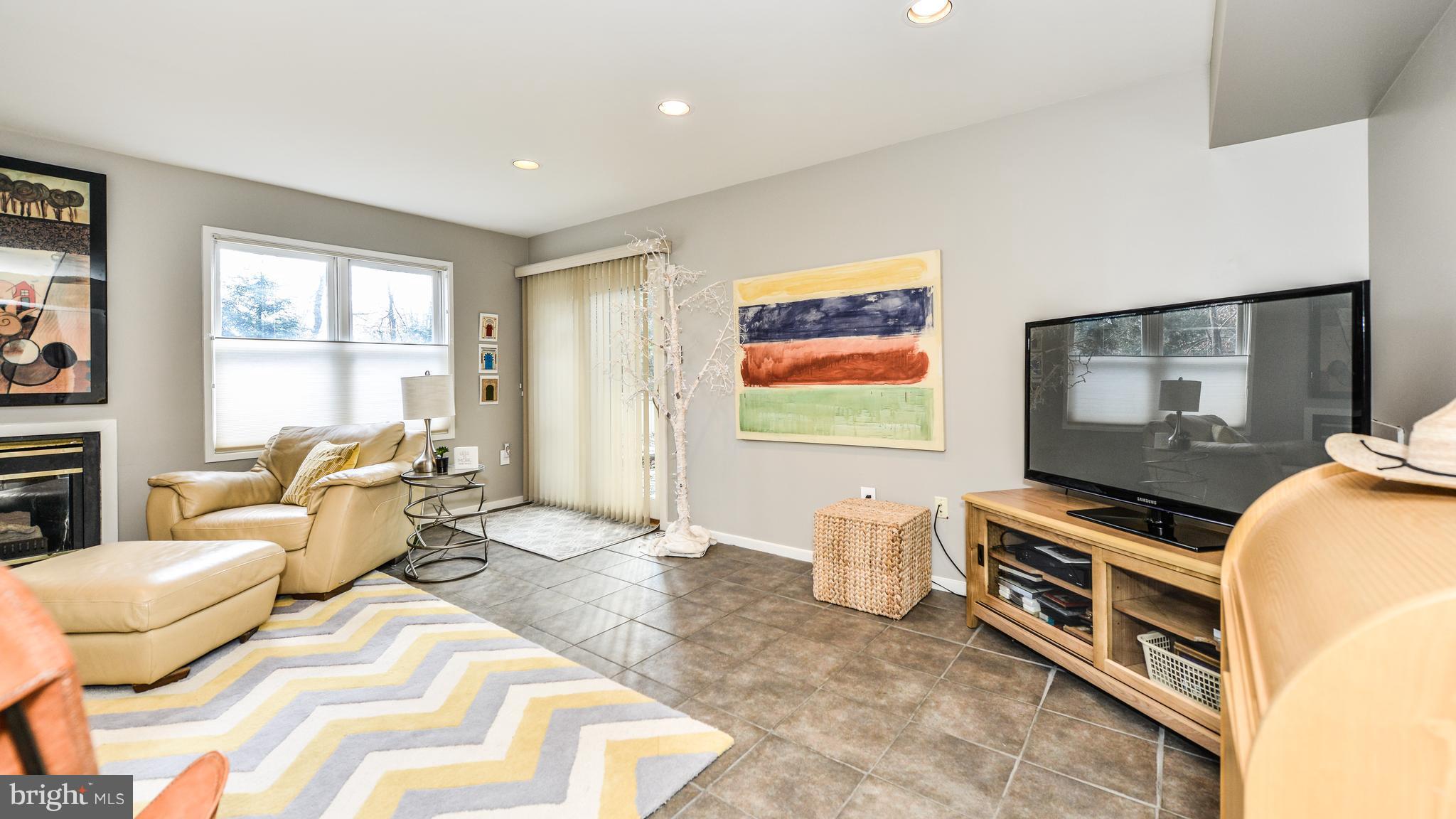 2041 Beacon Place Reston, VA 20191 - Photo 21 of 30 a bedroom with furniture and a flat screen tv