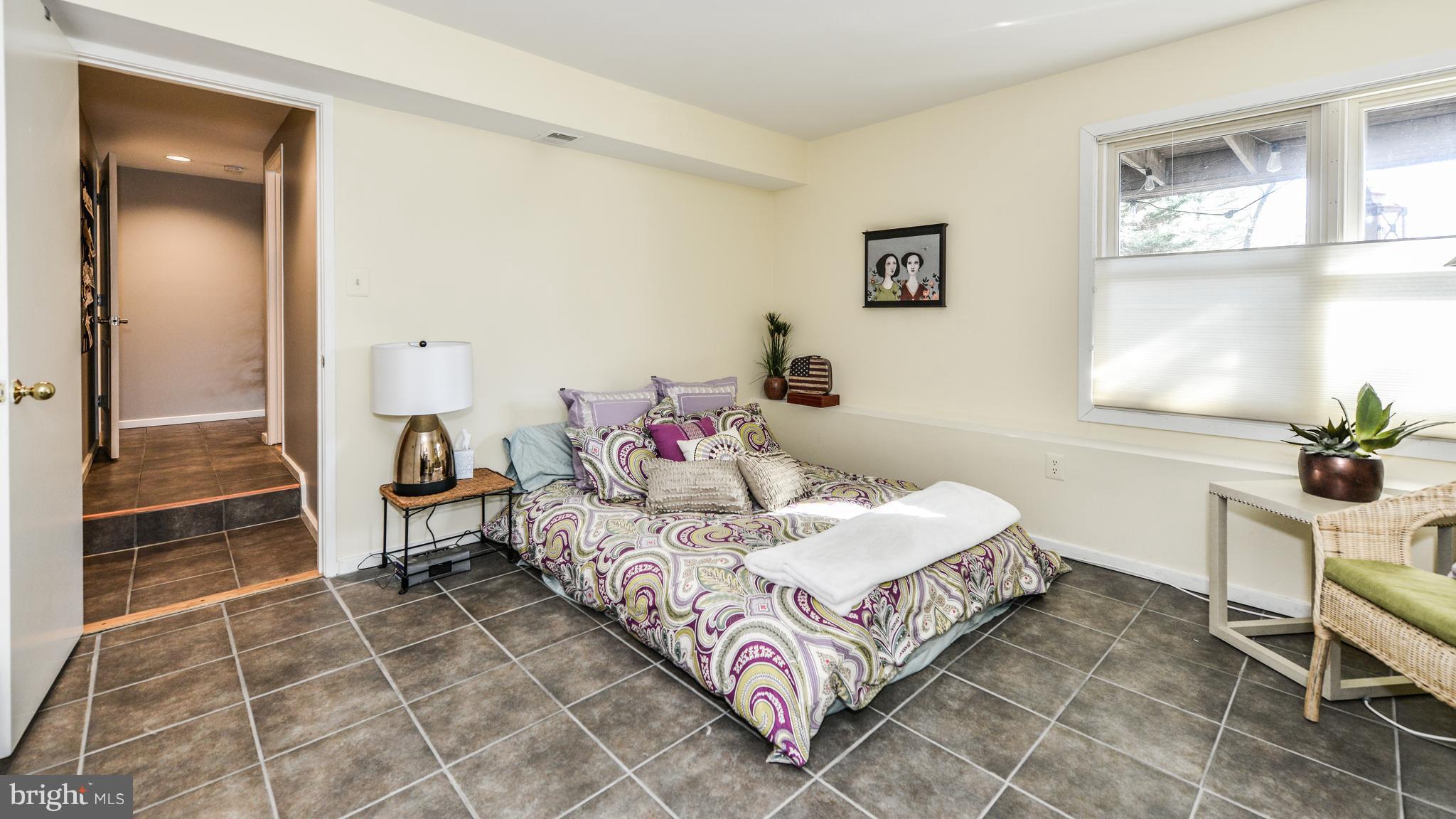 2041 Beacon Place Reston, VA 20191 - Photo 22 of 30 a bedroom with a bed and a window in it