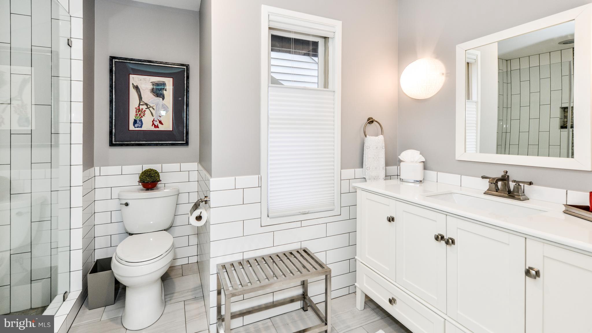 2041 Beacon Place Reston, VA 20191 - Photo 23 of 30 a bathroom with a toilet a sink and mirror