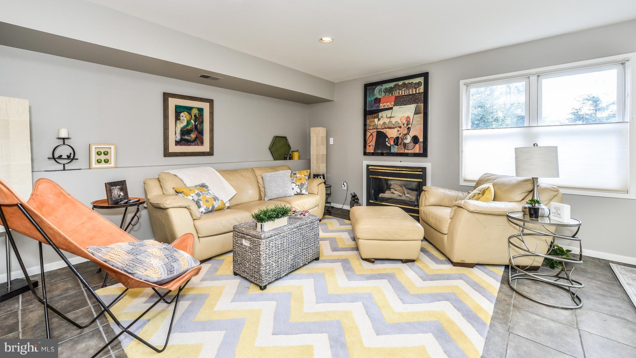 2041 Beacon Place Reston, VA 20191 - Photo 25 of 30 a living room with furniture a flat screen tv and a table