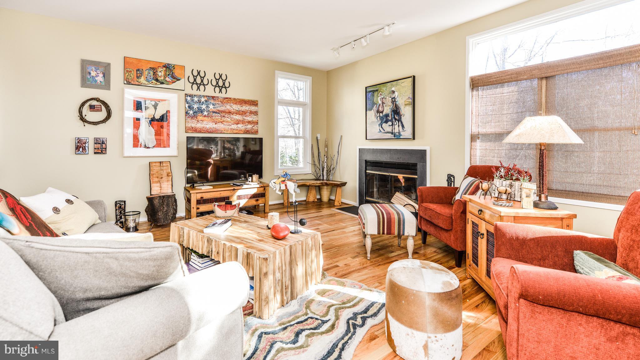 2041 Beacon Place Reston, VA 20191 - Photo 10 of 30 a living room with furniture and a fireplace