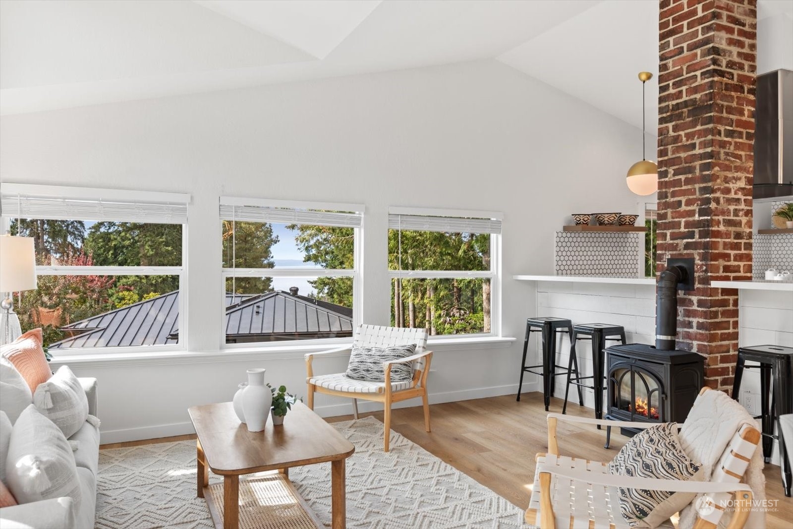 15908 68th Avenue West Edmonds, WA 98026 - Photo 12 of 40 a living room with furniture and a floor to ceiling window