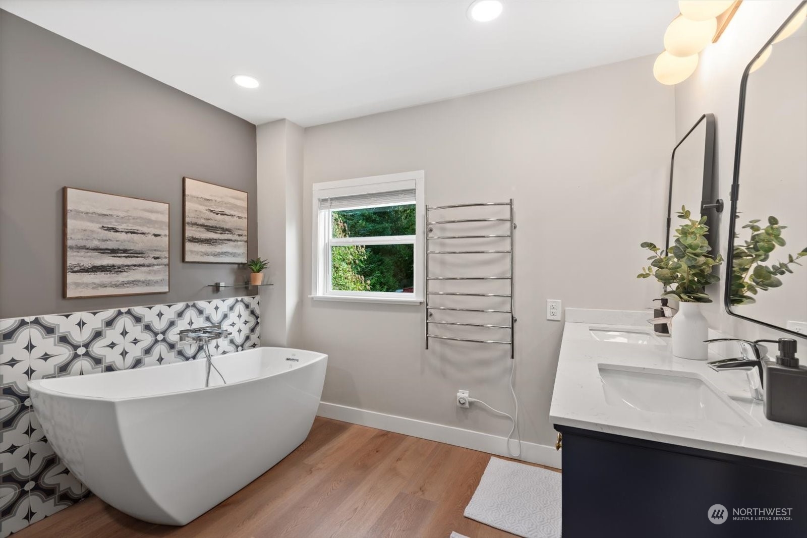 15908 68th Avenue West Edmonds, WA 98026 - Photo 17 of 40 a white bath tub sitting in a bathroom next to a window