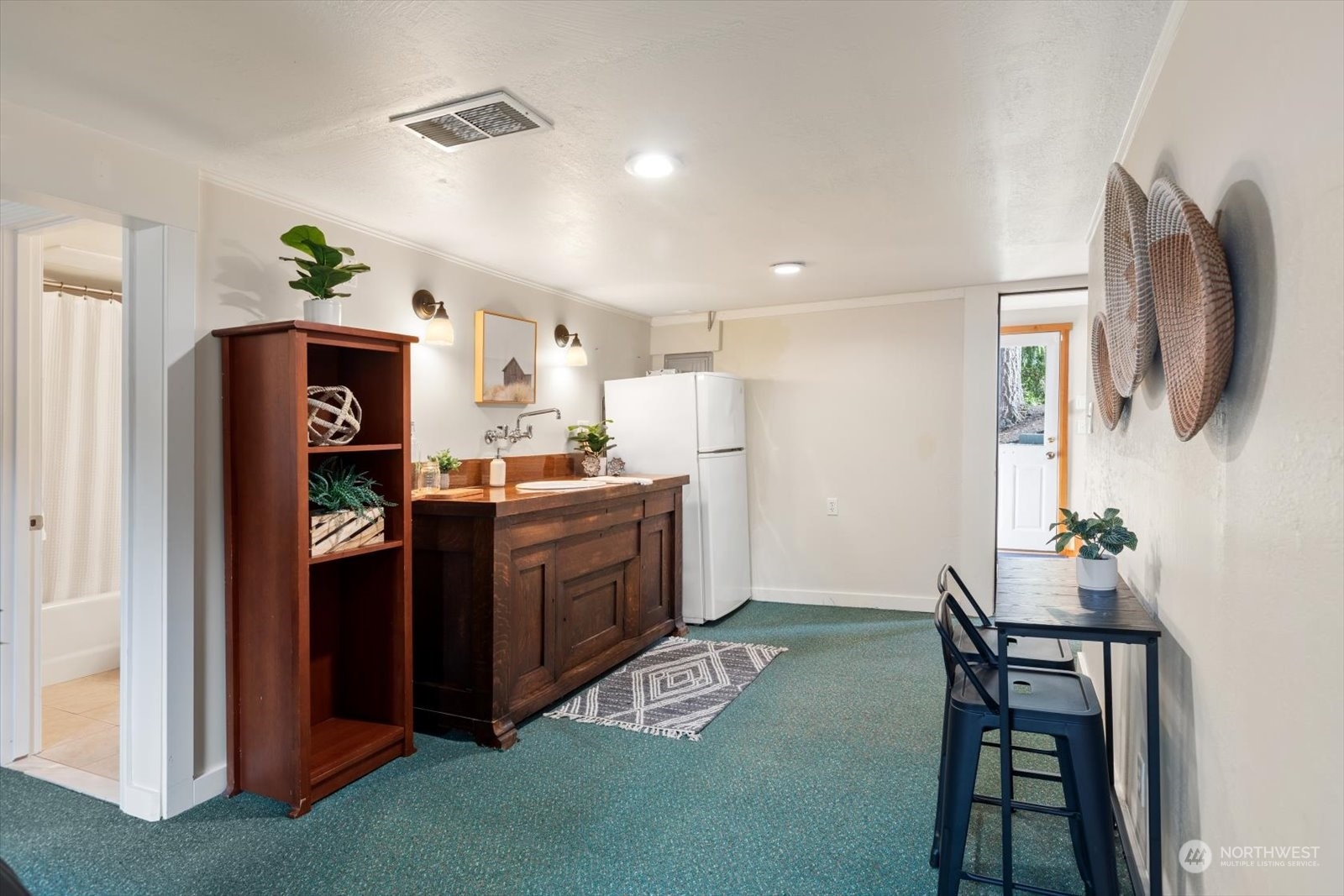 15908 68th Avenue West Edmonds, WA 98026 - Photo 21 of 40 a kitchen with a refrigerator and a wooden floor