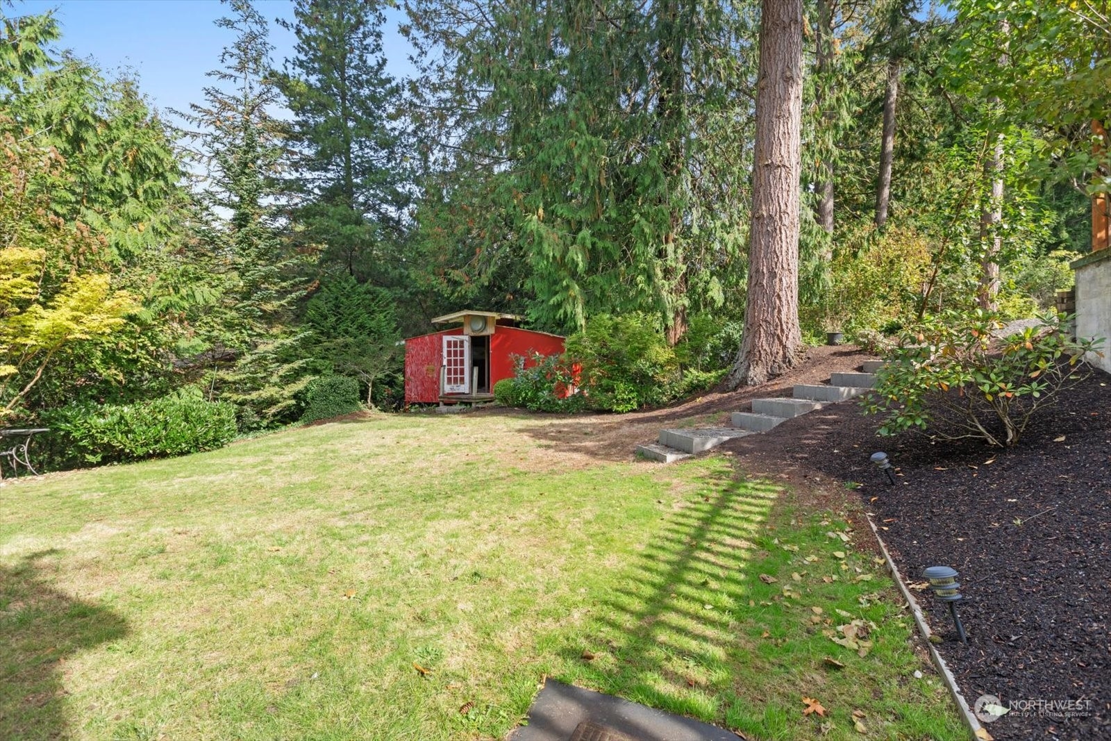 15908 68th Avenue West Edmonds, WA 98026 - Photo 36 of 40 a swimming pool with trees in the background