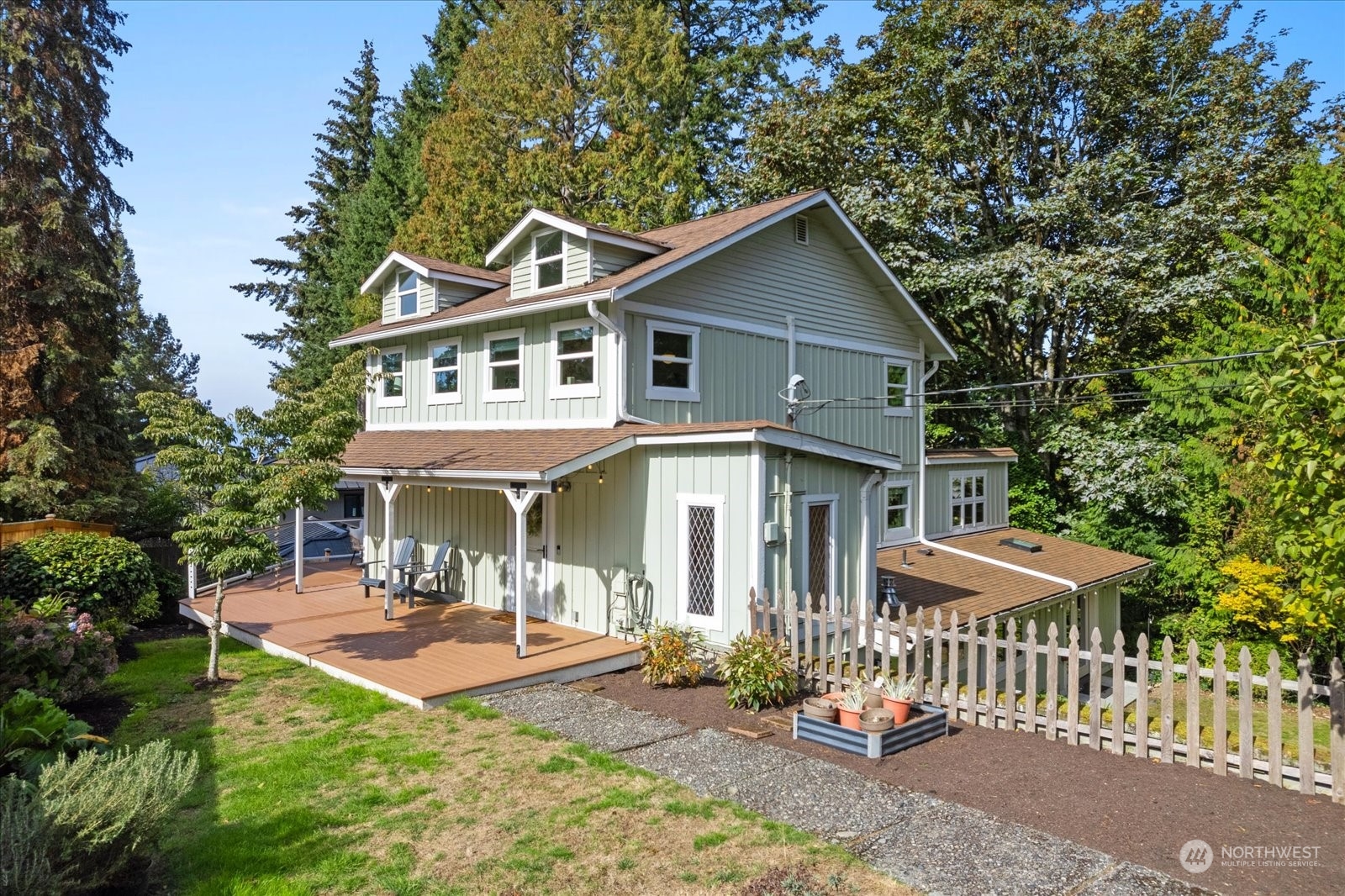 15908 68th Avenue West Edmonds, WA 98026 - Photo 37 of 40 a front view of a house with a yard table and chairs