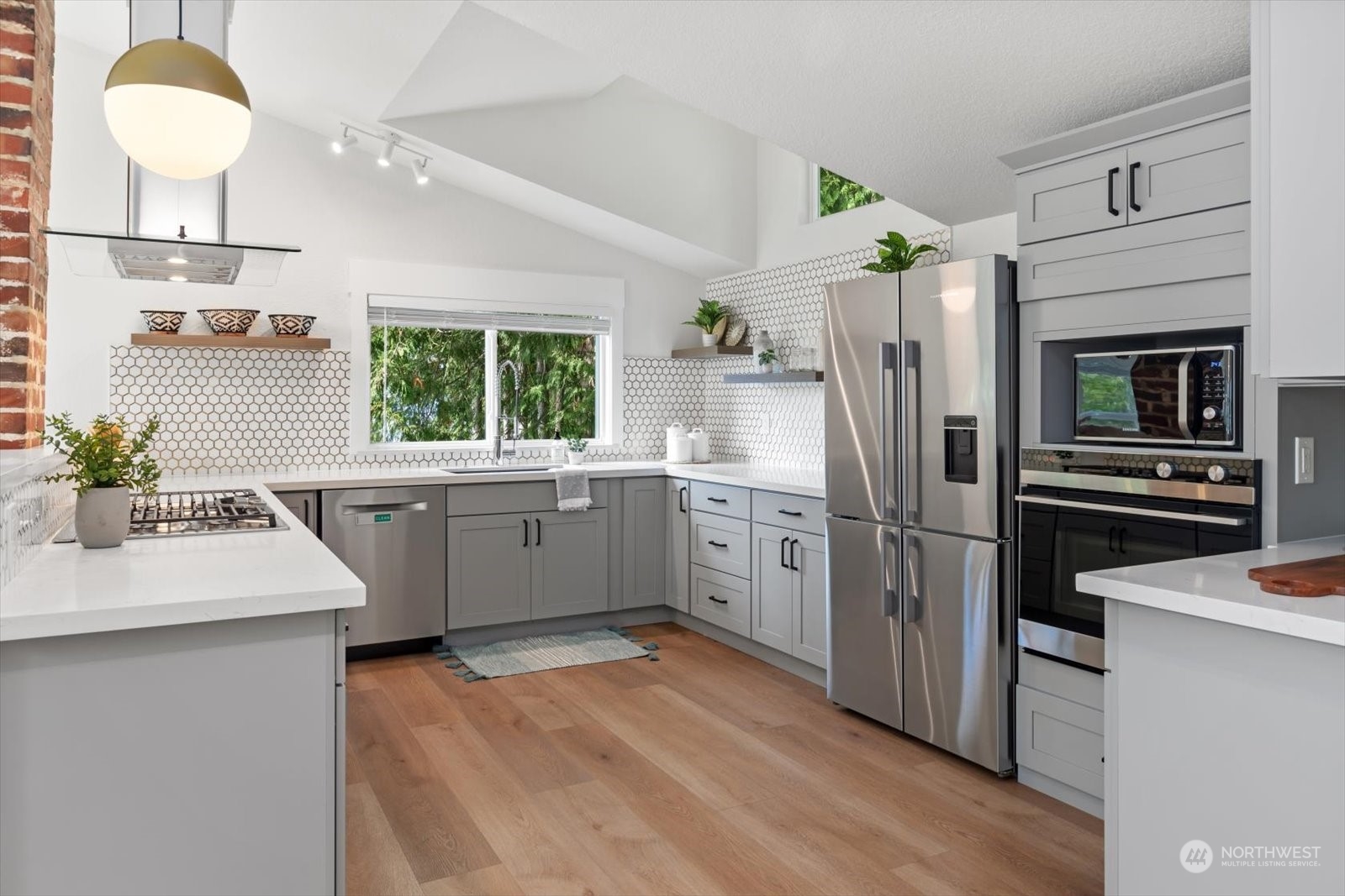 15908 68th Avenue West Edmonds, WA 98026 - Photo 6 of 40 a kitchen with white cabinets and stainless steel appliances