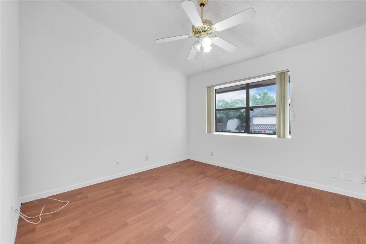 4718 Northwest 82nd Avenue, Unit 1706 Lauderhill, FL 33351 - Photo 7 of 12 an empty room with a window