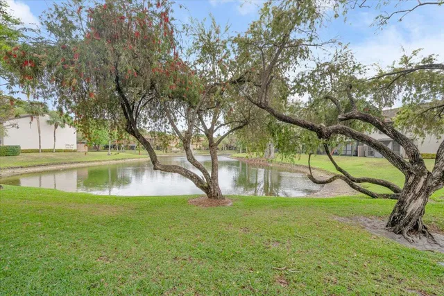 a swimming pool with outdoor seating and yard