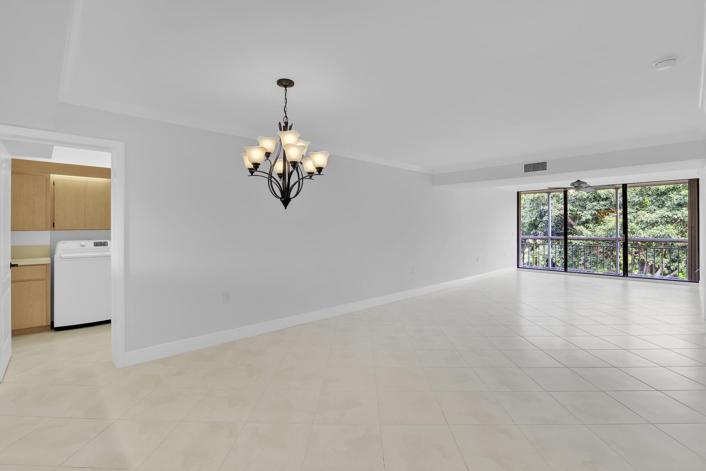 6133 Balboa Circle, Unit 304 Boca Raton, FL 33433 - Photo 17 of 48 a view of an empty room with a window