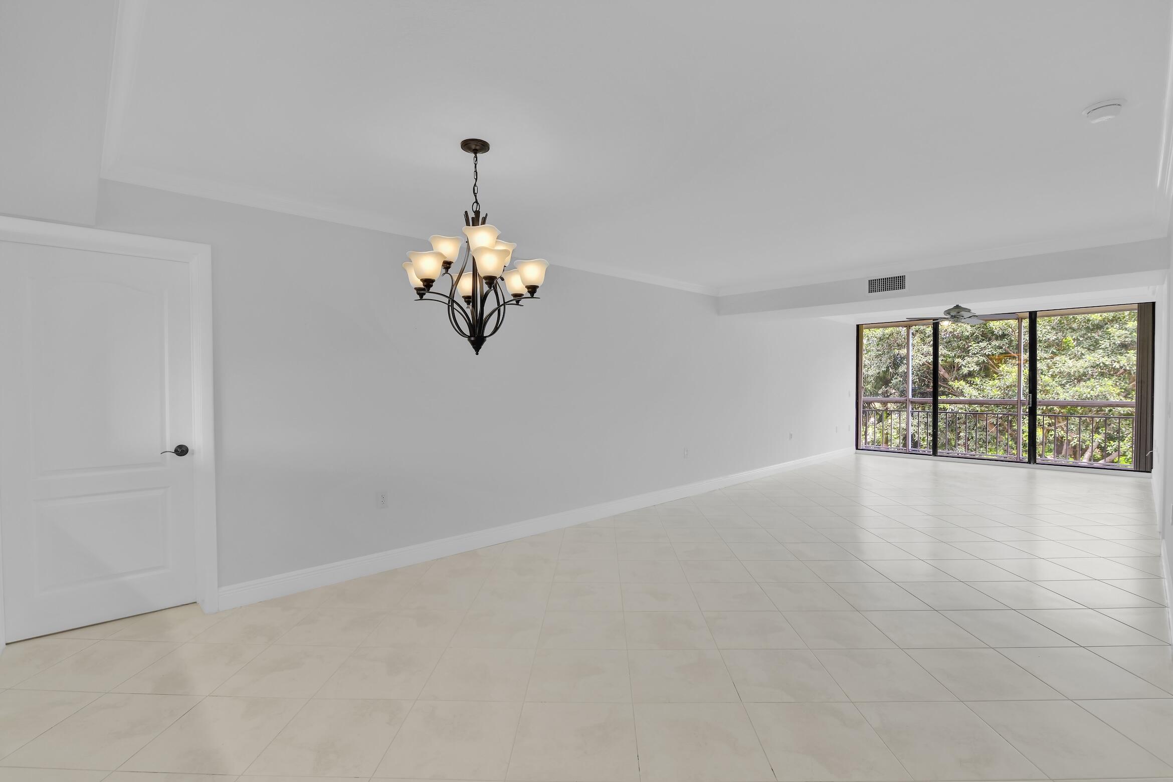 6133 Balboa Circle, Unit 304 Boca Raton, FL 33433 - Photo 18 of 48 a view of an empty room with a window