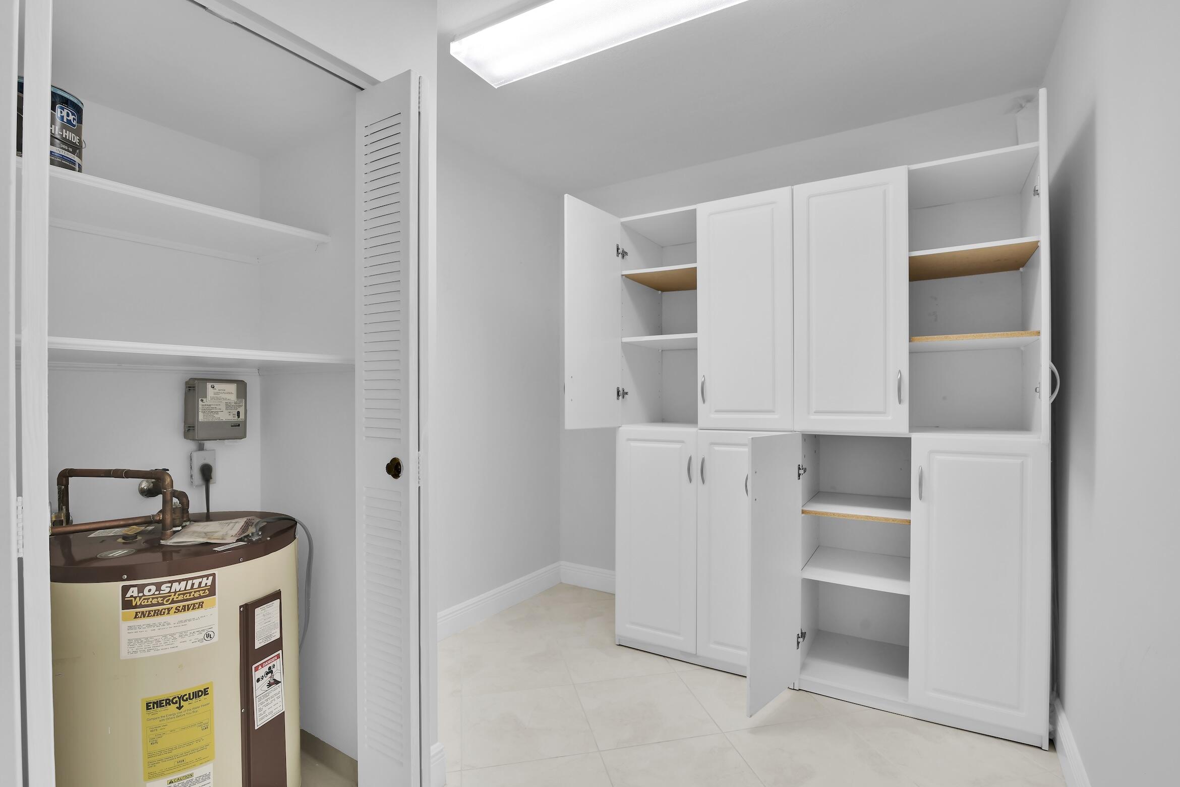 6133 Balboa Circle, Unit 304 Boca Raton, FL 33433 - Photo 21 of 48 a view of walk in closet with empty racks