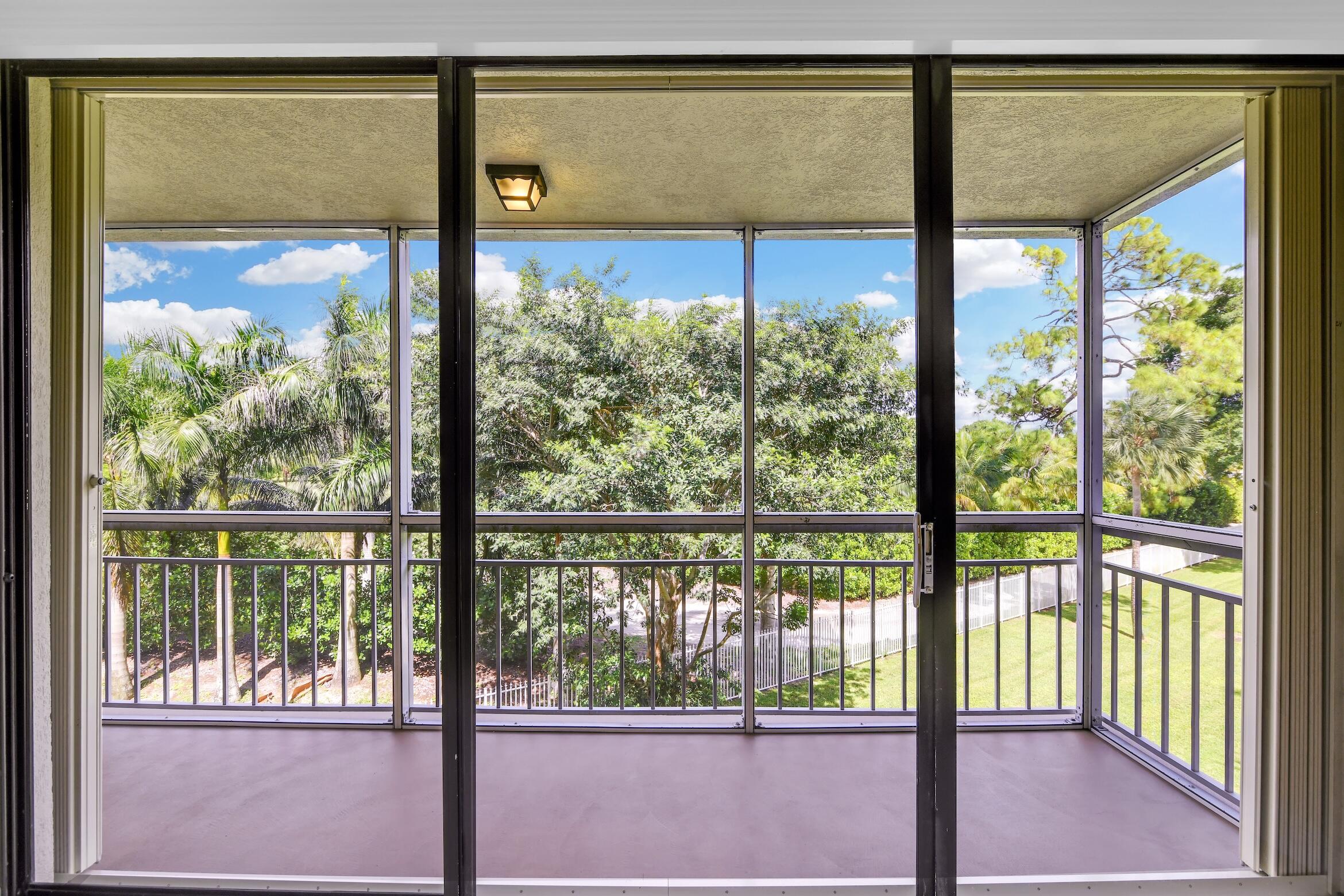 6133 Balboa Circle, Unit 304 Boca Raton, FL 33433 - Photo 24 of 48 a view of a glass door with a outdoor space