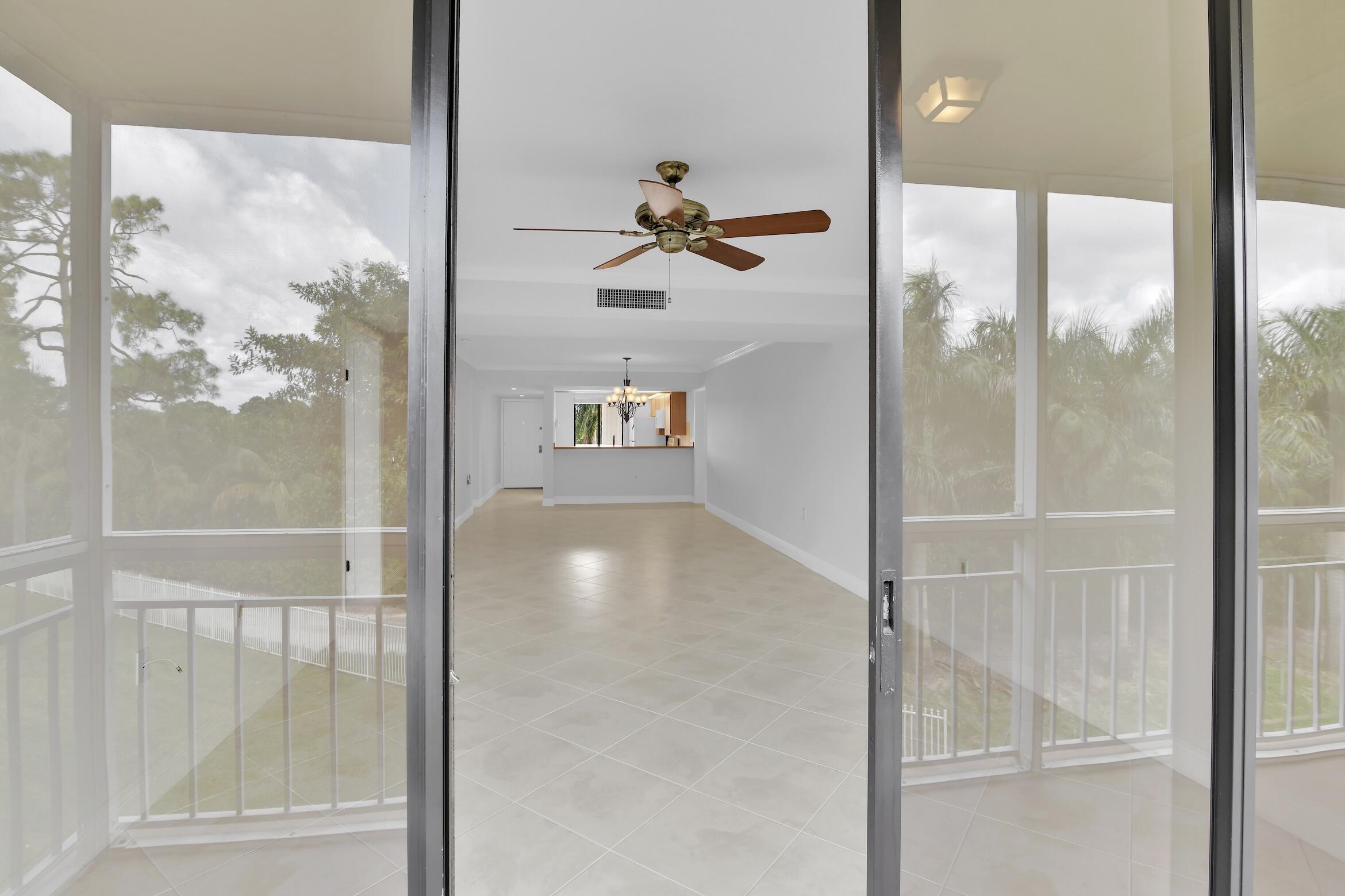 6133 Balboa Circle, Unit 304 Boca Raton, FL 33433 - Photo 25 of 48 a view of a glass door with a glass door