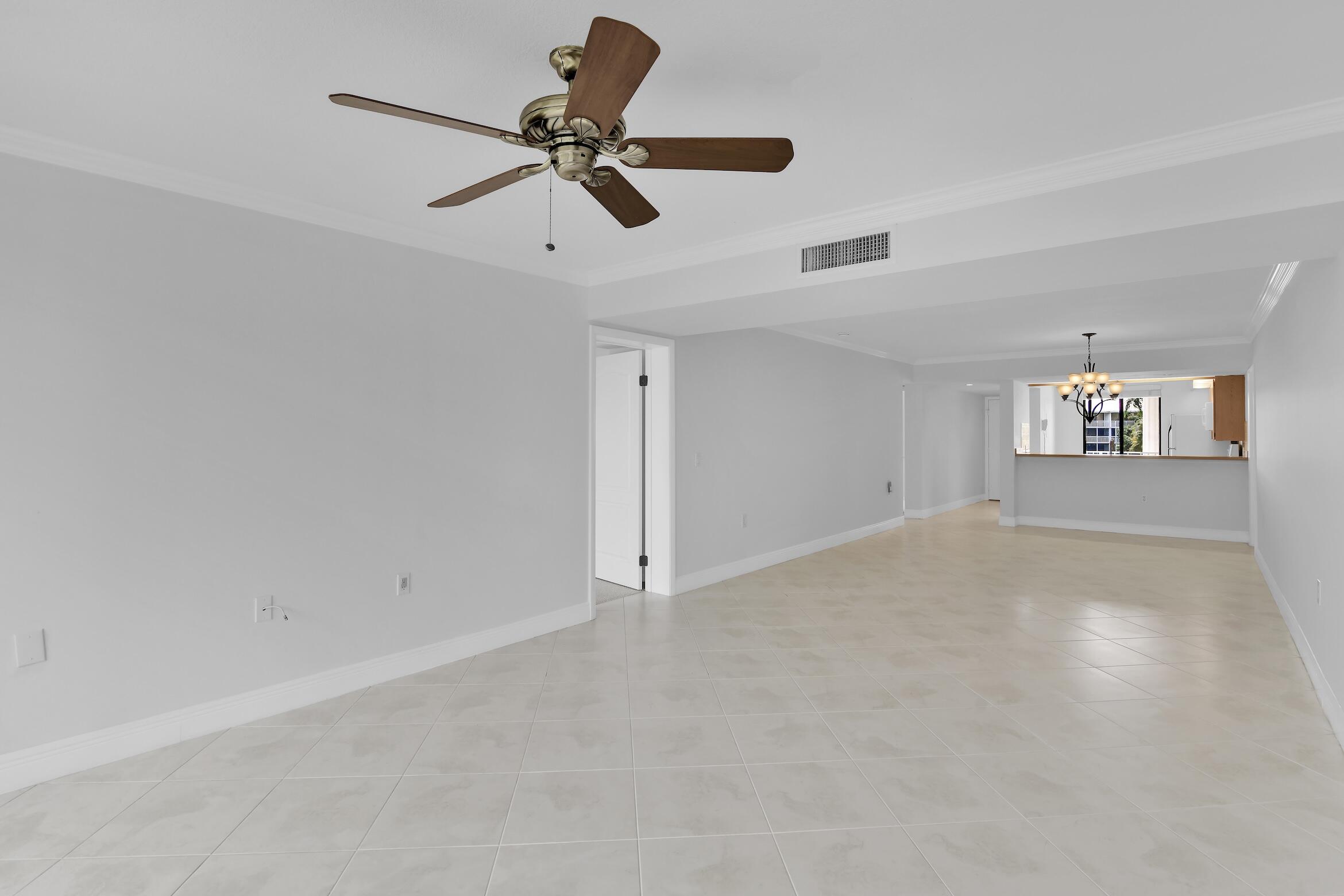 6133 Balboa Circle, Unit 304 Boca Raton, FL 33433 - Photo 29 of 48 a view of empty room with windows