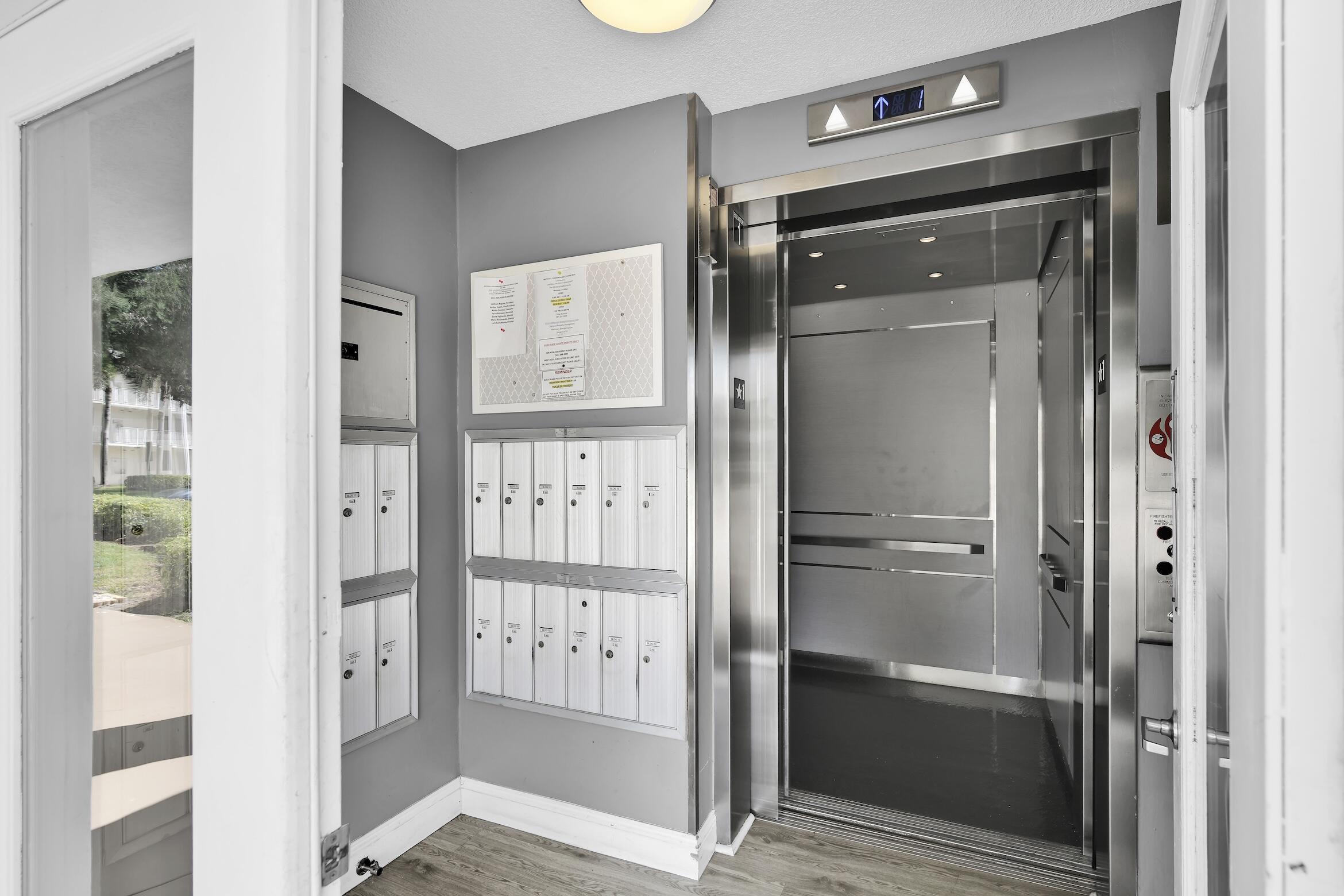 6133 Balboa Circle, Unit 304 Boca Raton, FL 33433 - Photo 3 of 48 a bathroom with a glass shower door and a mirror