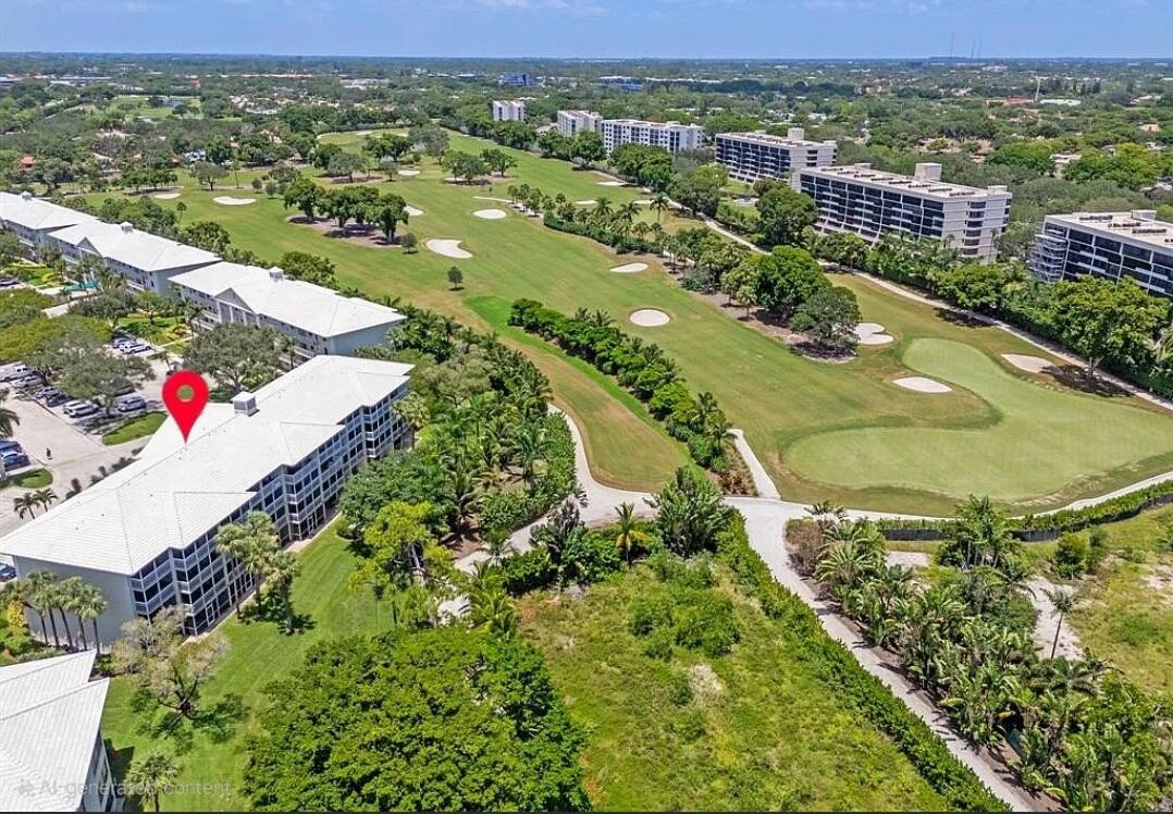 6133 Balboa Circle, Unit 304 Boca Raton, FL 33433 - Photo 46 of 48 an aerial view of residential houses with outdoor space