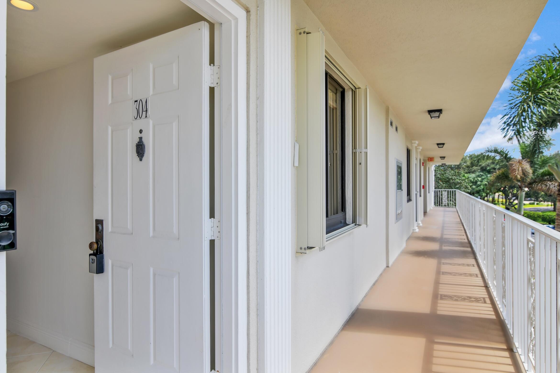 6133 Balboa Circle, Unit 304 Boca Raton, FL 33433 - Photo 5 of 48 a view of a house with balcony