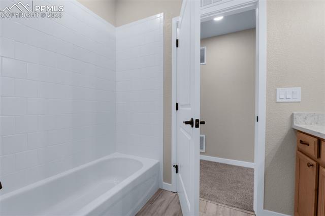 2935 Hoofprint Road Peyton, CO 80831 - Photo 5 of 10 Basement Full Bath with Solid Surface Counters LVP Flooring and Soft Close Drawers