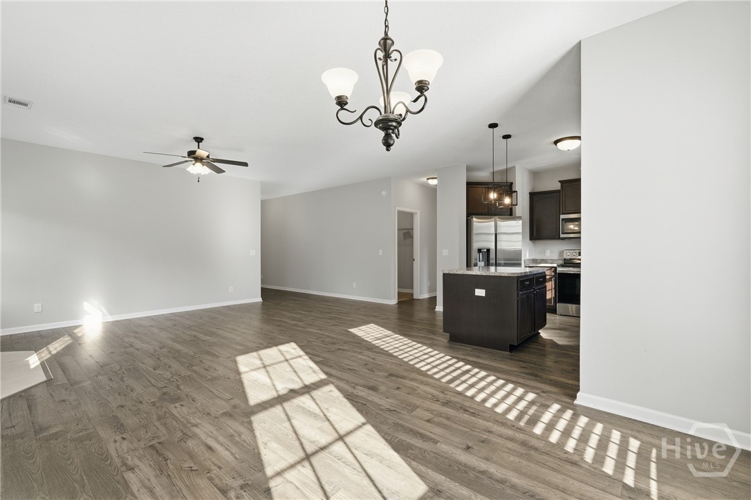 1297 Talmadge Road Allenhurst, GA 31301 - Photo 15 of 32 Beautiful luxury vinyl plank flooring throughout the living areas