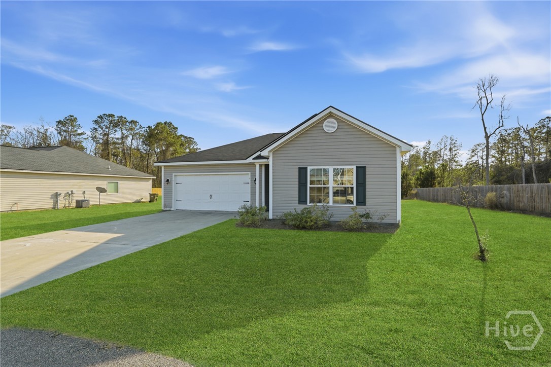 1297 Talmadge Road Allenhurst, GA 31301 - Photo 3 of 32 Front of house *grass has been digitally enhanced*