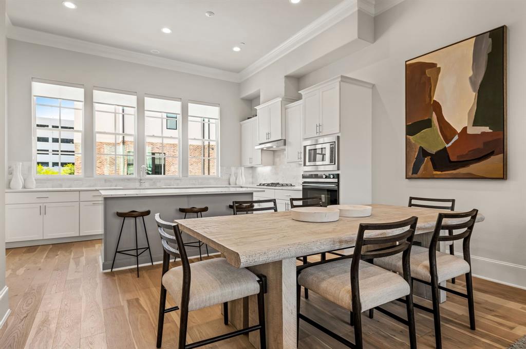 5449 Patterson Court Irving, TX 75039 - Photo 2 of 18 a view of a dining room with furniture and wooden floor