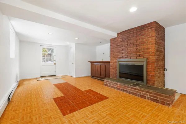 a spacious bedroom with a bed and a fireplace