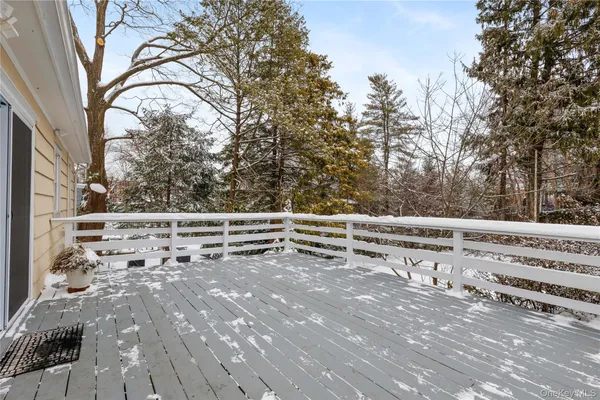 a view of a house with a snow in the yard