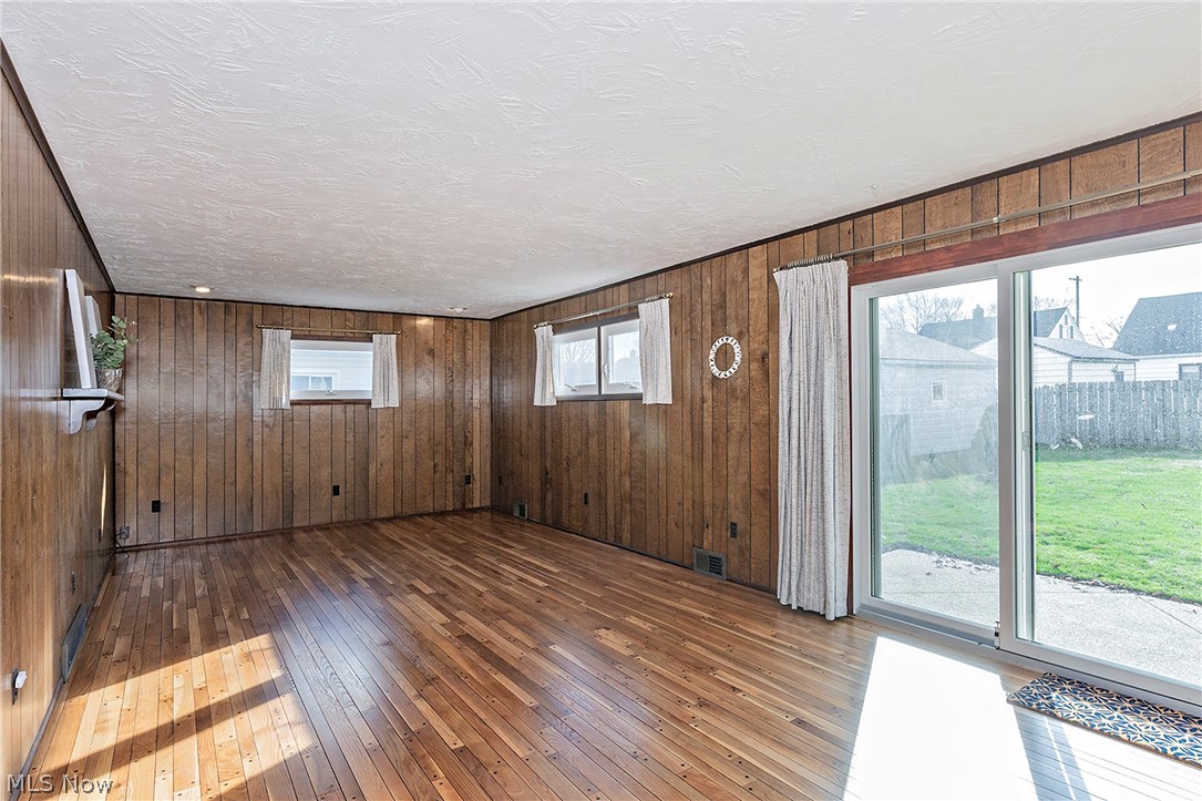 30104 Warren Road Wickliffe, OH 44092 - Photo 12 of 45 Warm walnut panelling and another room with refiinished flooring
