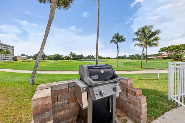 a view of a garden with a slide and a lake view