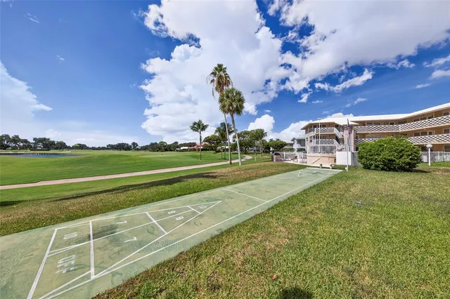 a view of a golf course with a big yard