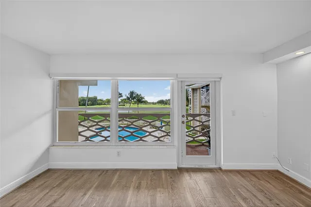 wooden floor in a empty room with window