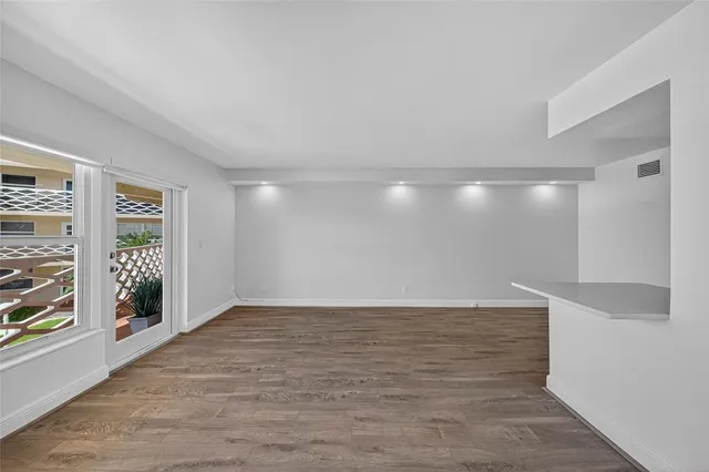 a view of an empty room with a window