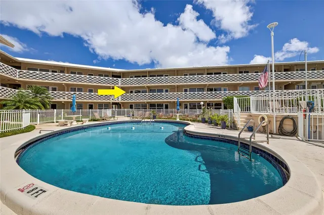 a view of swimming pool with seating space