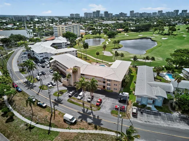 an aerial view of a houses with yard