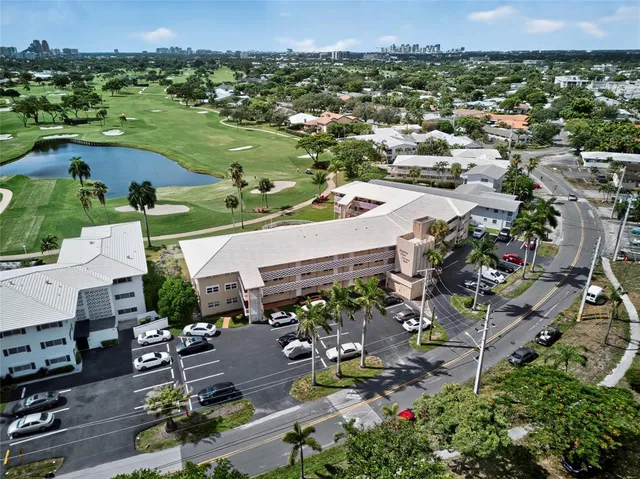 an aerial view of a houses with yard