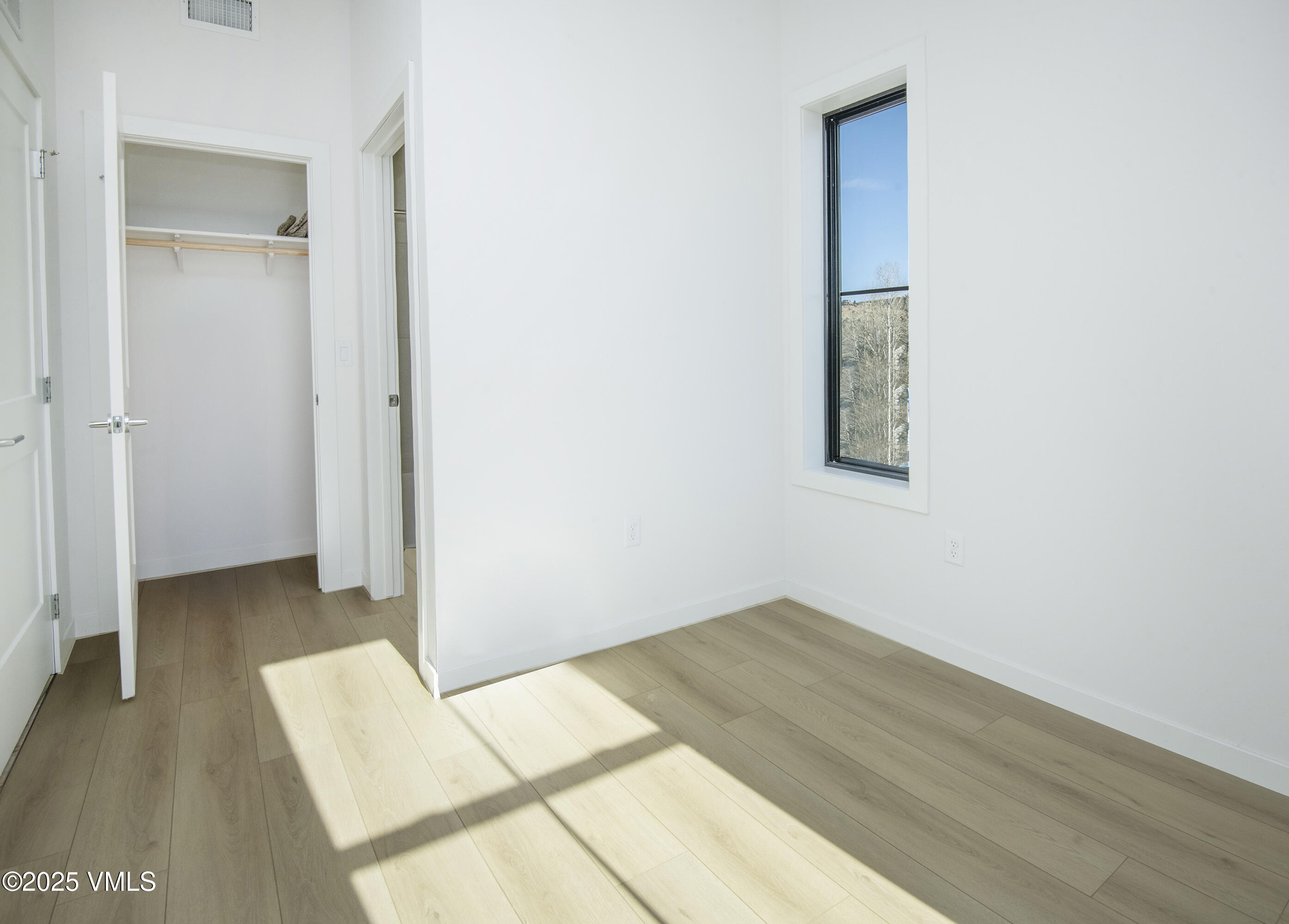 1200 Capitol Street, Unit 101 Eagle, CO 81631 - Photo 17 of 33 a view of a room with wooden floor and a bathroom