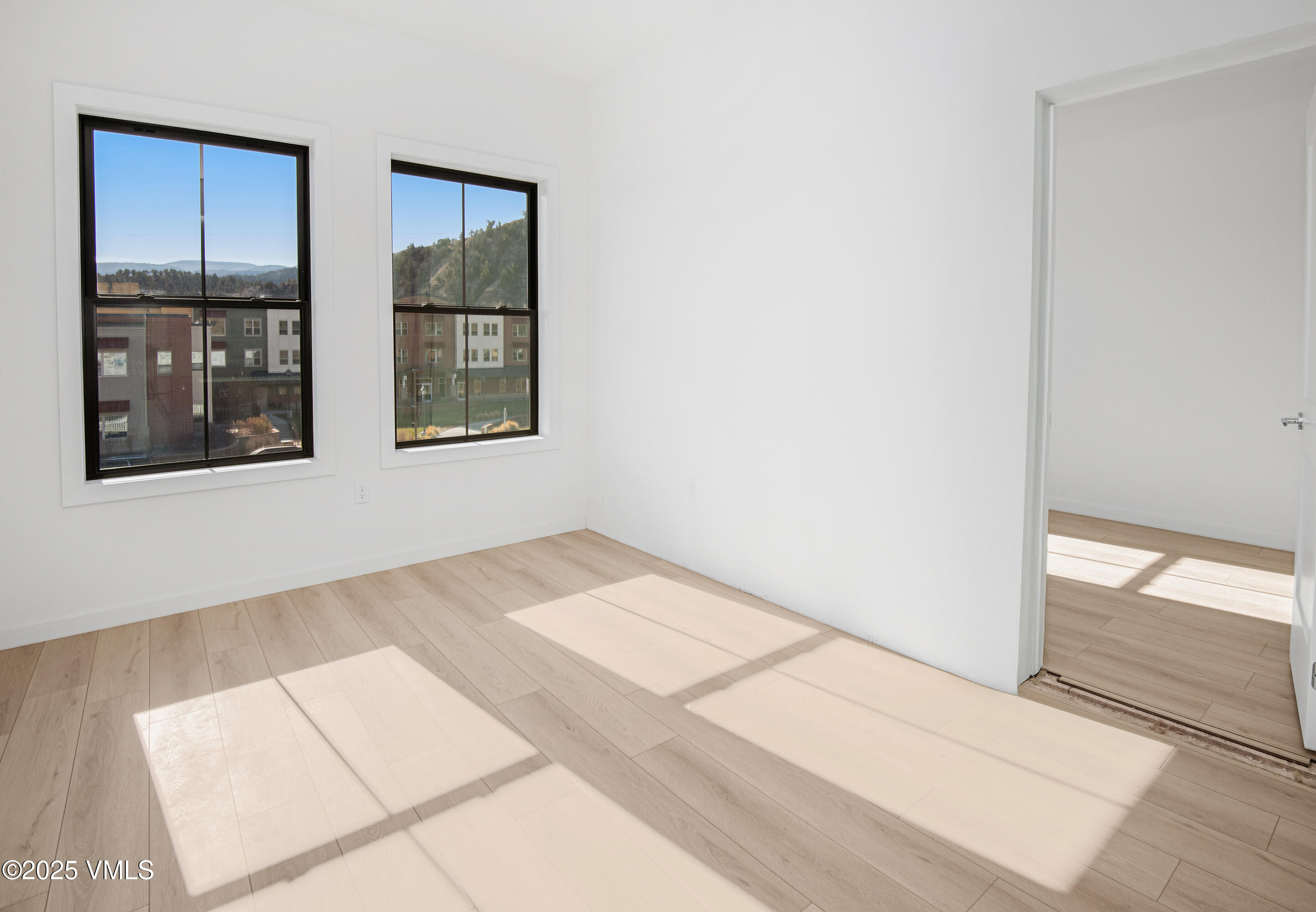 1200 Capitol Street, Unit 101 Eagle, CO 81631 - Photo 20 of 33 a view of an empty room with window and an entrance