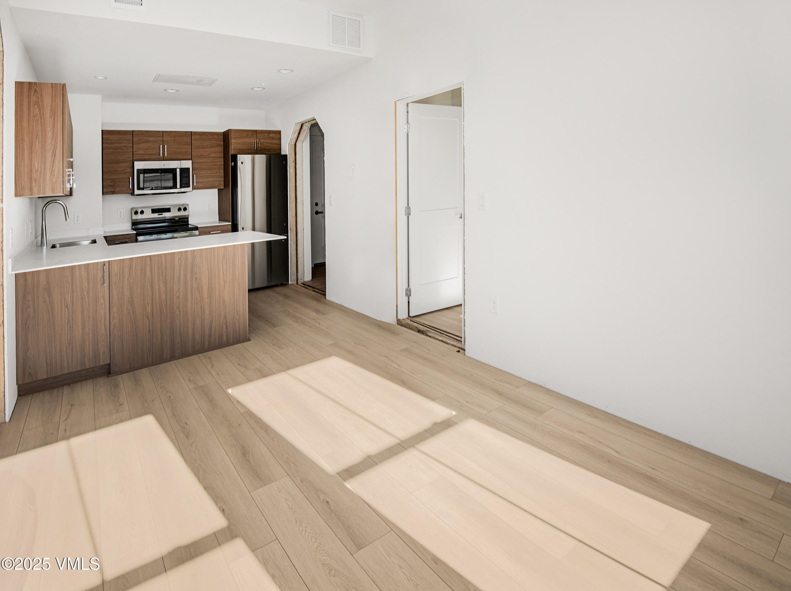 1200 Capitol Street, Unit 101 Eagle, CO 81631 - Photo 7 of 33 a kitchen with a refrigerator stove and microwave